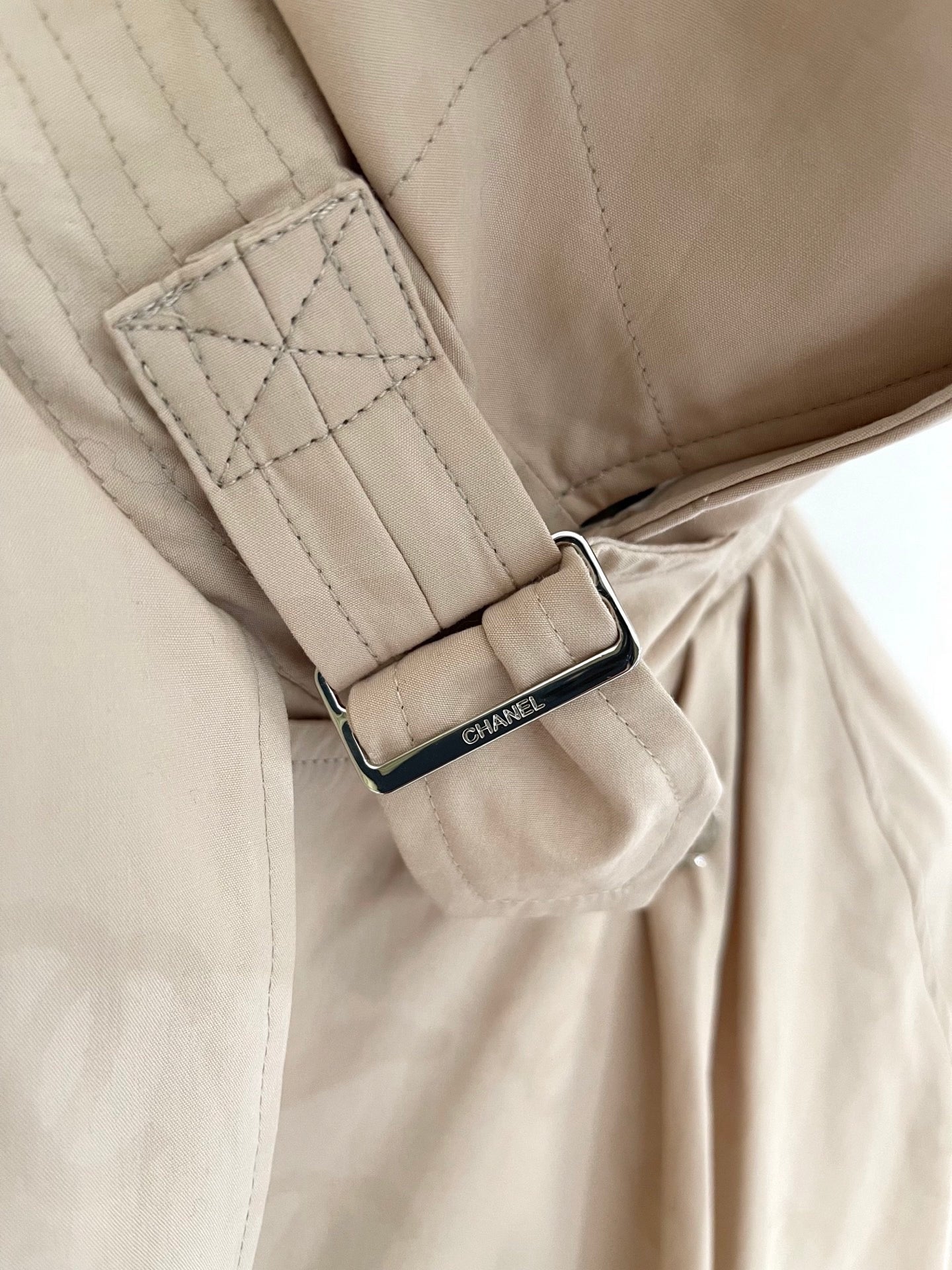 Chan's new short trench coat with subtle logo print