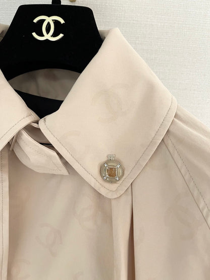 Chan's new short trench coat with subtle logo print