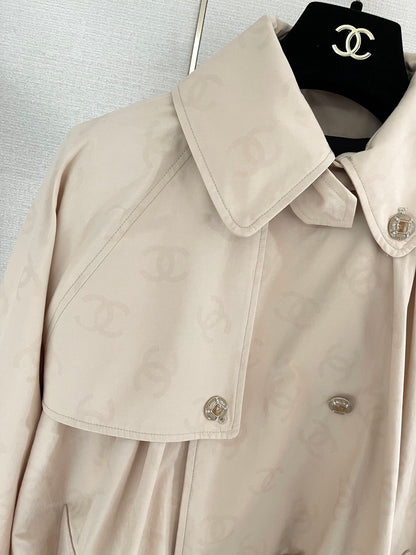 Chan's new short trench coat with subtle logo print