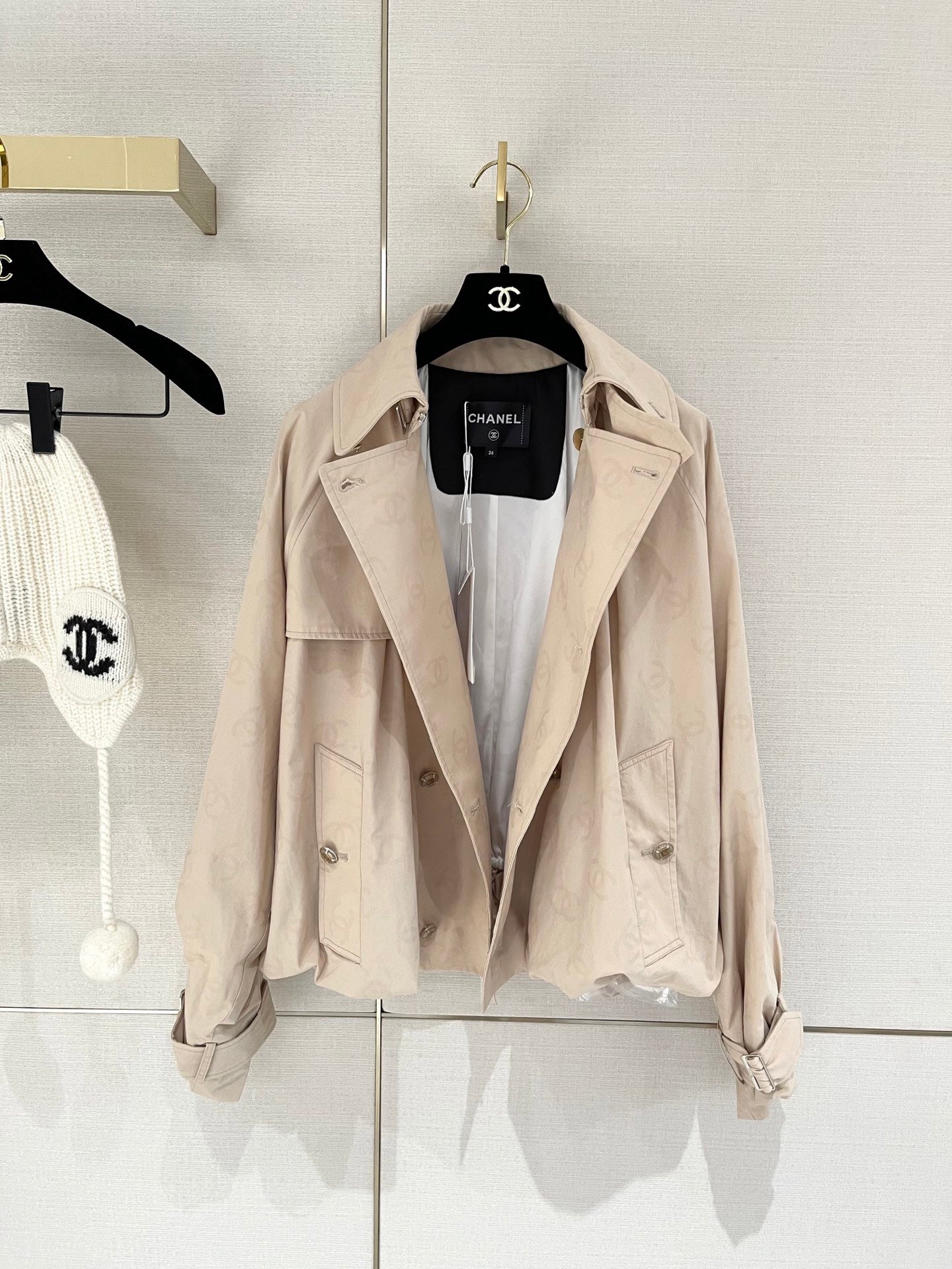 Chan's new short trench coat with subtle logo print